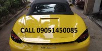 Yellow Porsche 718 Boxster Petrol AT