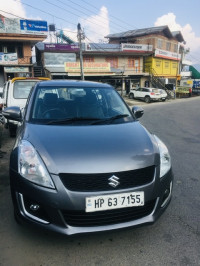 Glistening Grey Maruti Suzuki Swift VXI