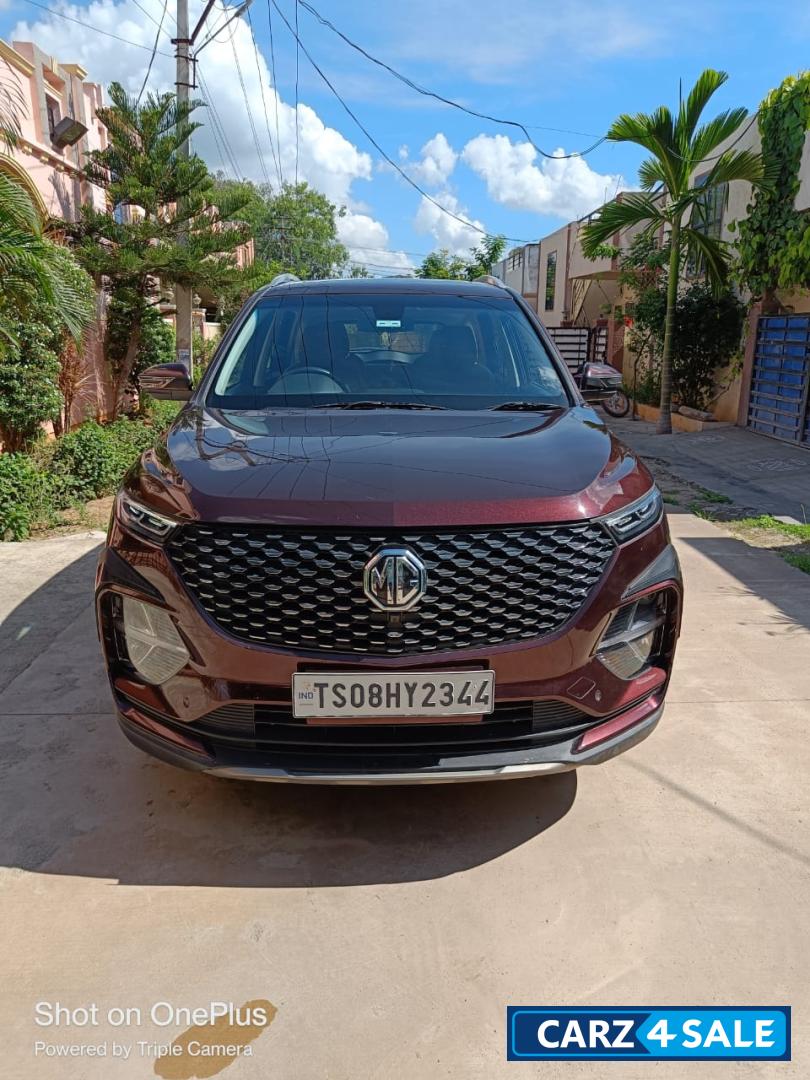 Burgundy Red MG Hector Plus Sharp Petrol Hybrid 6 Seater