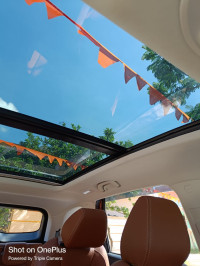 Burgundy Red MG Hector Plus Sharp Petrol Hybrid 6 Seater