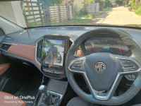 Burgundy Red MG Hector Plus Sharp Petrol Hybrid 6 Seater