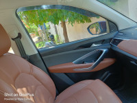 Burgundy Red MG Hector Plus Sharp Petrol Hybrid 6 Seater