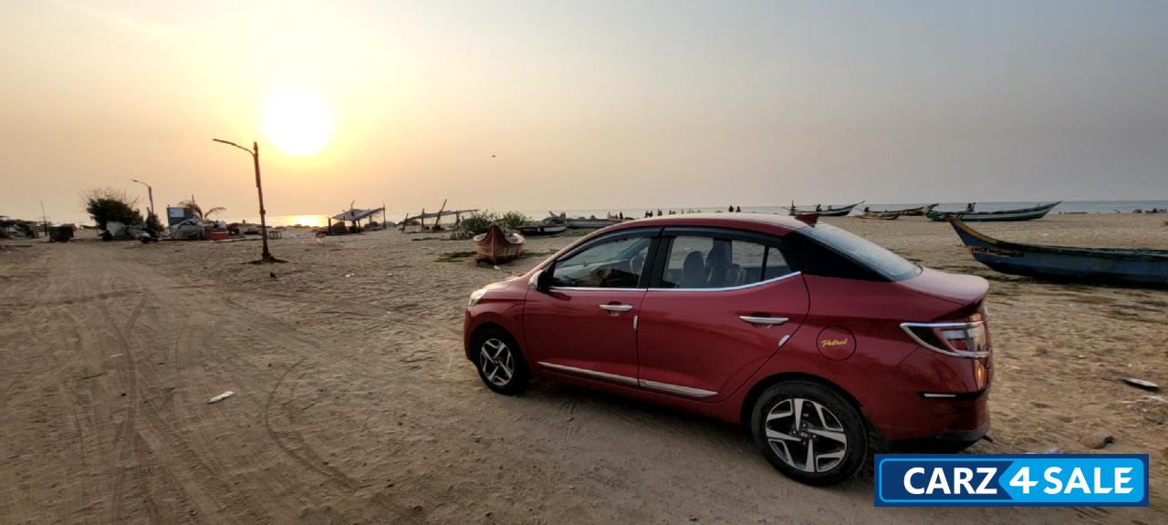 Fiery Red Hyundai Aura 1.2L Kappa Petrol AMT SX Plus