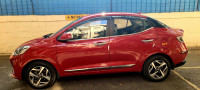 Fiery Red Hyundai Aura 1.2L Kappa Petrol AMT SX Plus