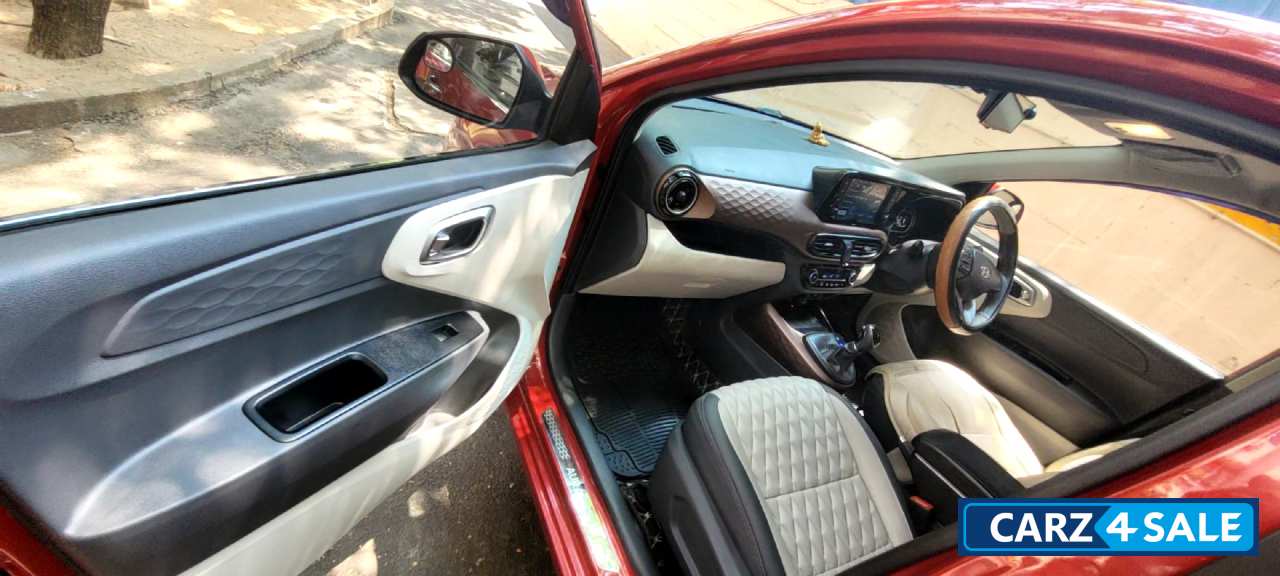 Fiery Red Hyundai Aura 1.2L Kappa Petrol AMT SX Plus