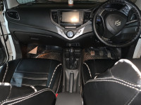 Pearl White Maruti Suzuki Baleno Zeta