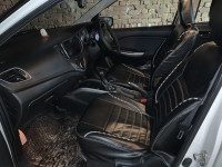 Pearl White Maruti Suzuki Baleno Zeta