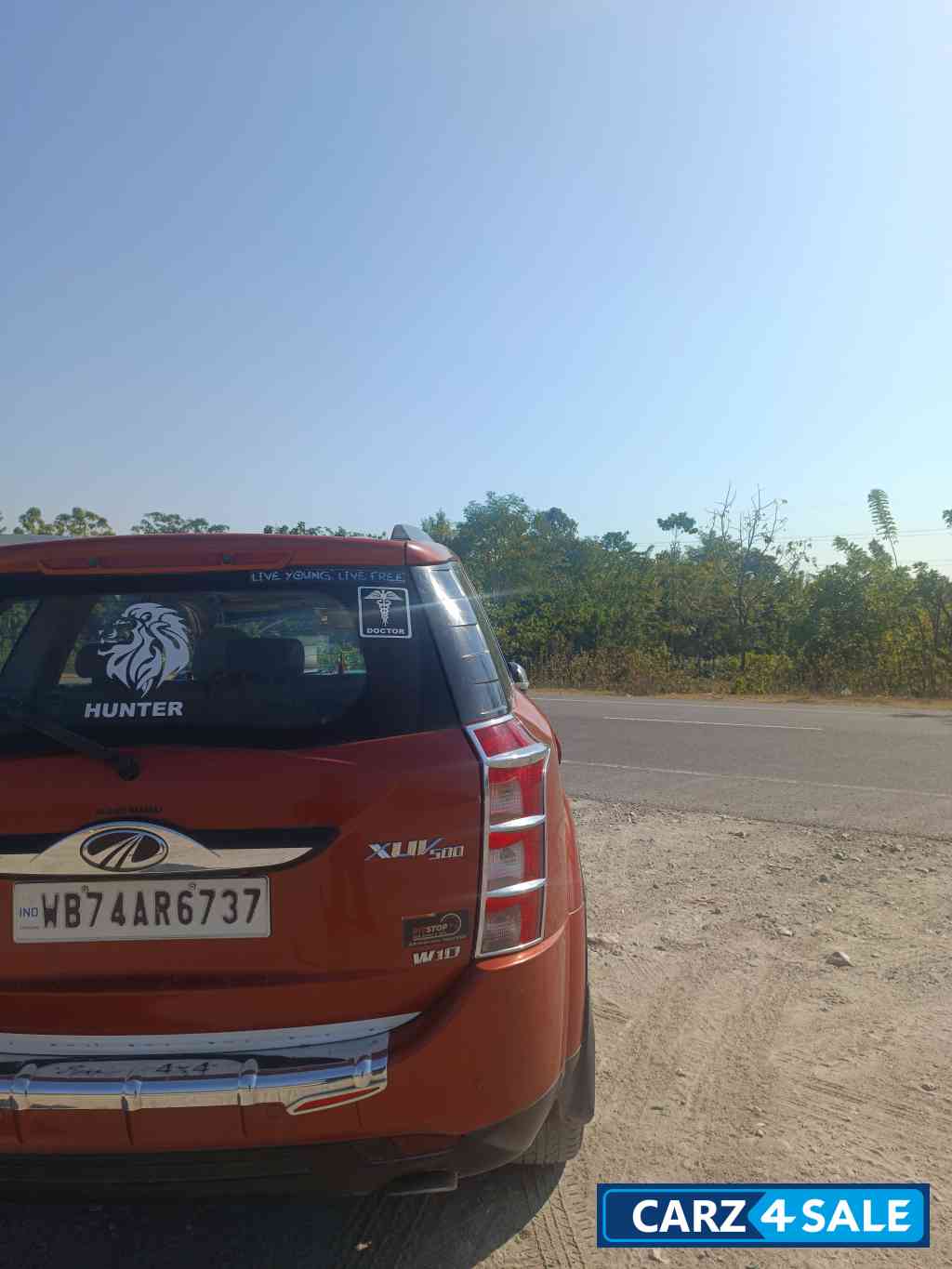 Sunset Orange Mahindra XUV 500 W10 R FWD