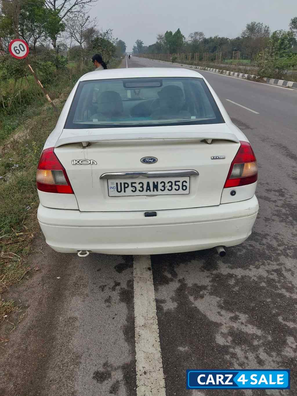 White Ford Ikon Icool