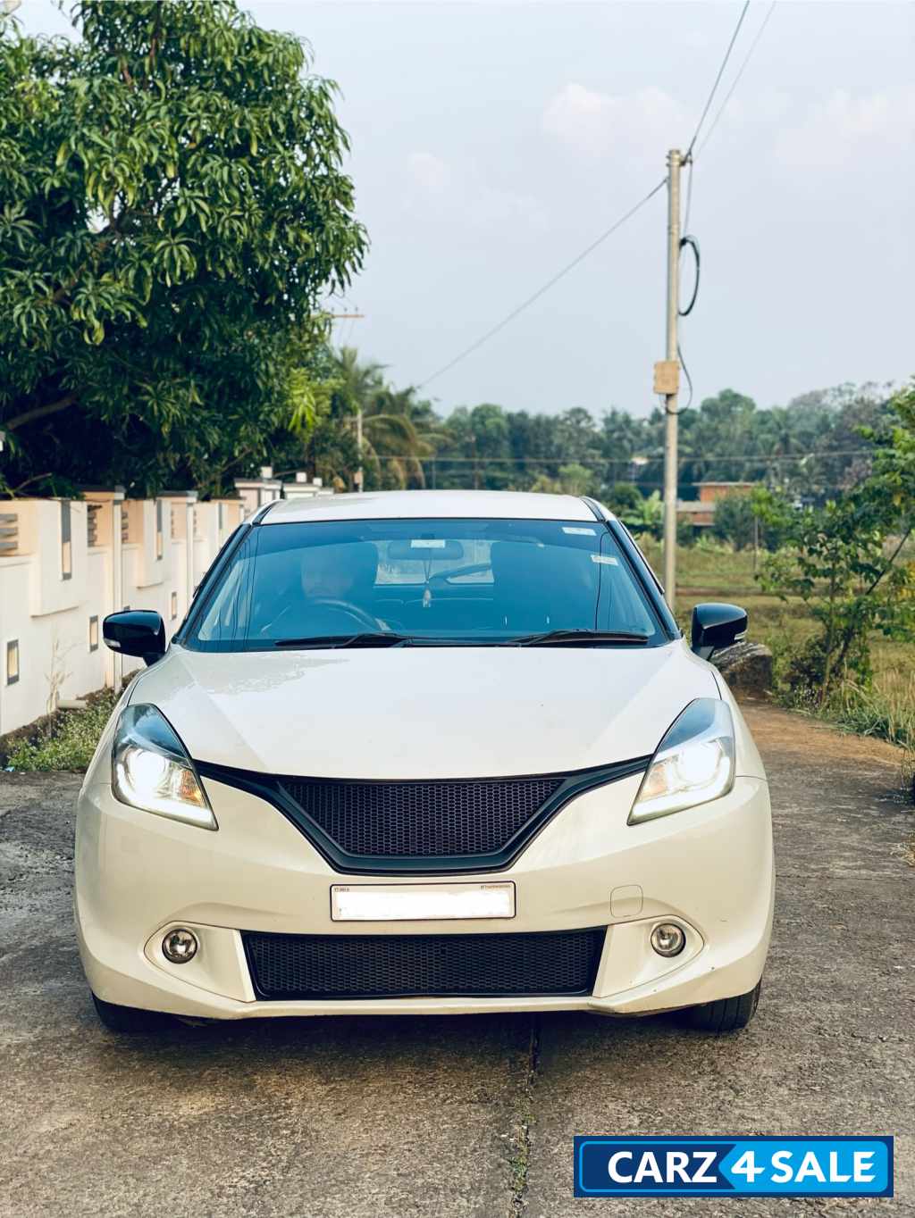 White Maruti Suzuki Baleno Delta