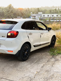 White Maruti Suzuki Baleno Delta