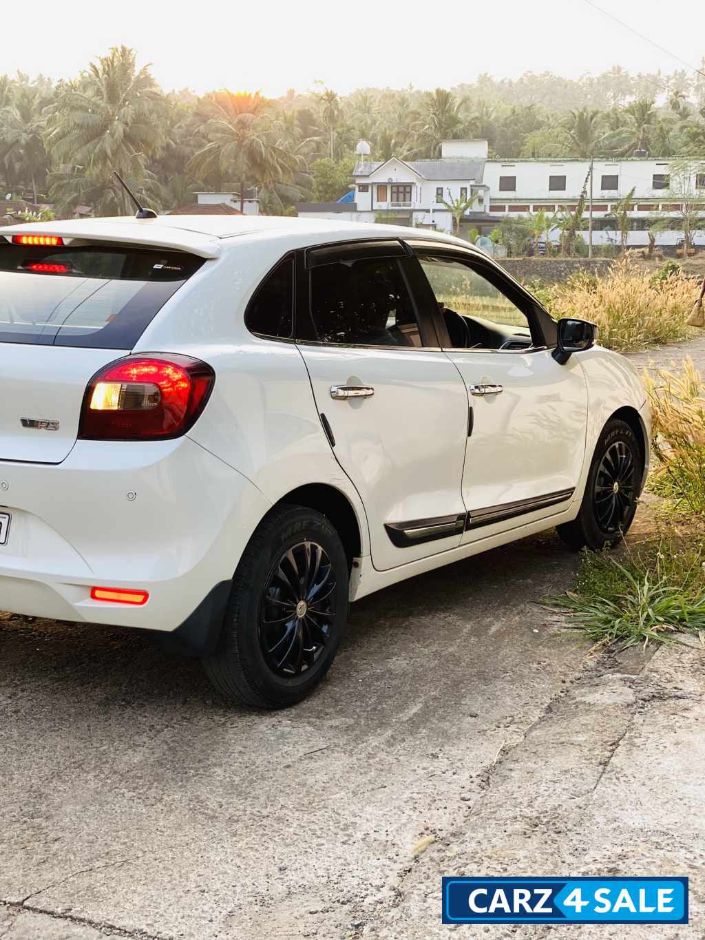 White Maruti Suzuki Baleno Delta