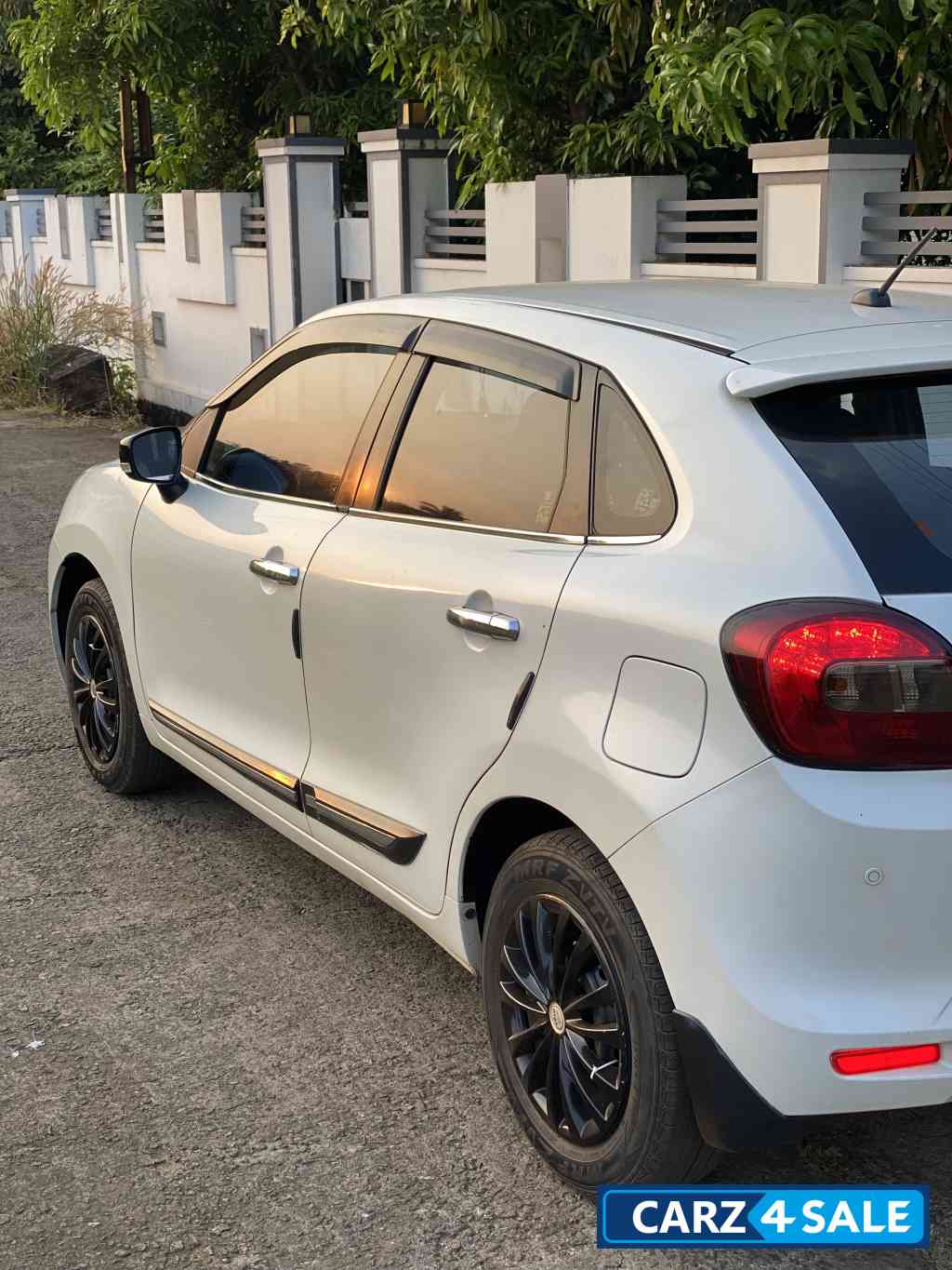 White Maruti Suzuki Baleno Delta