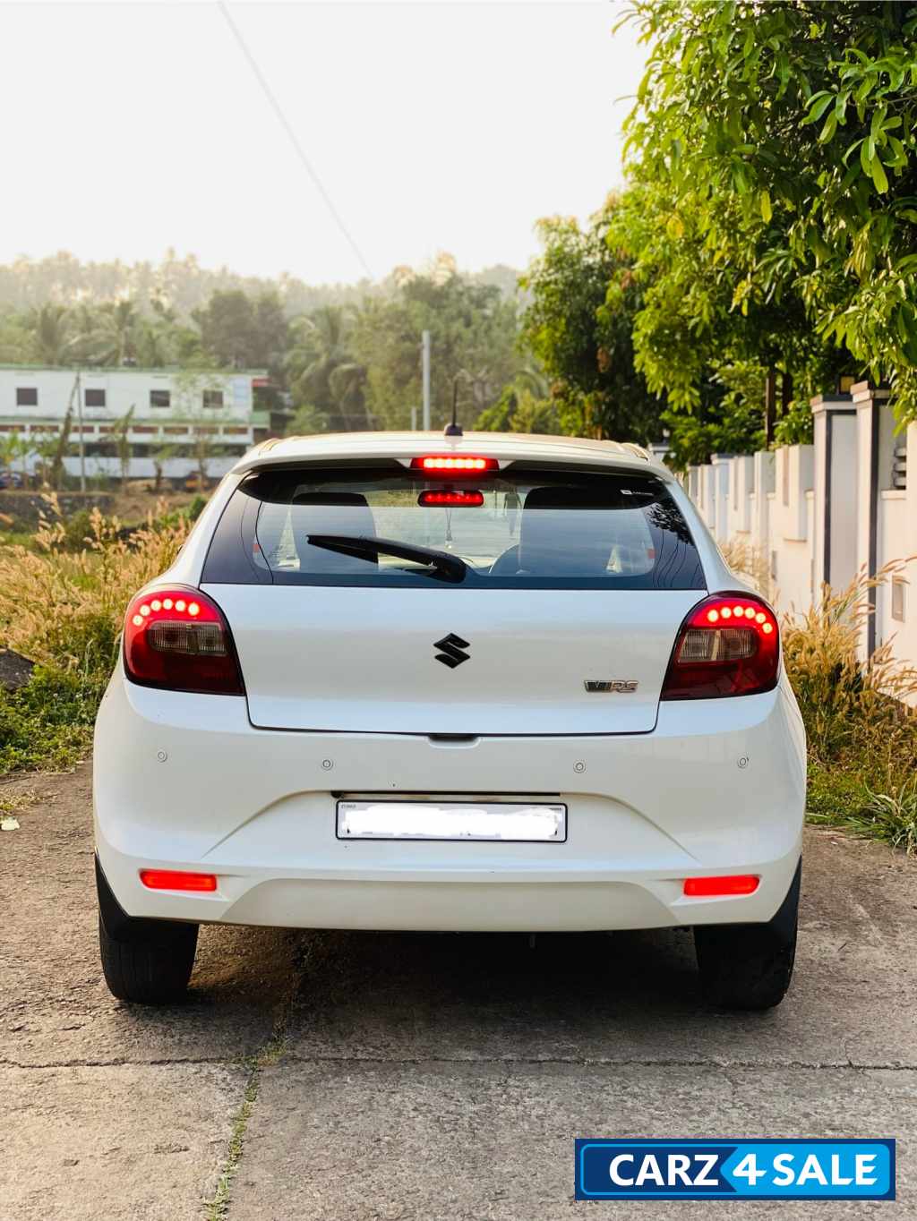 White Maruti Suzuki Baleno Delta