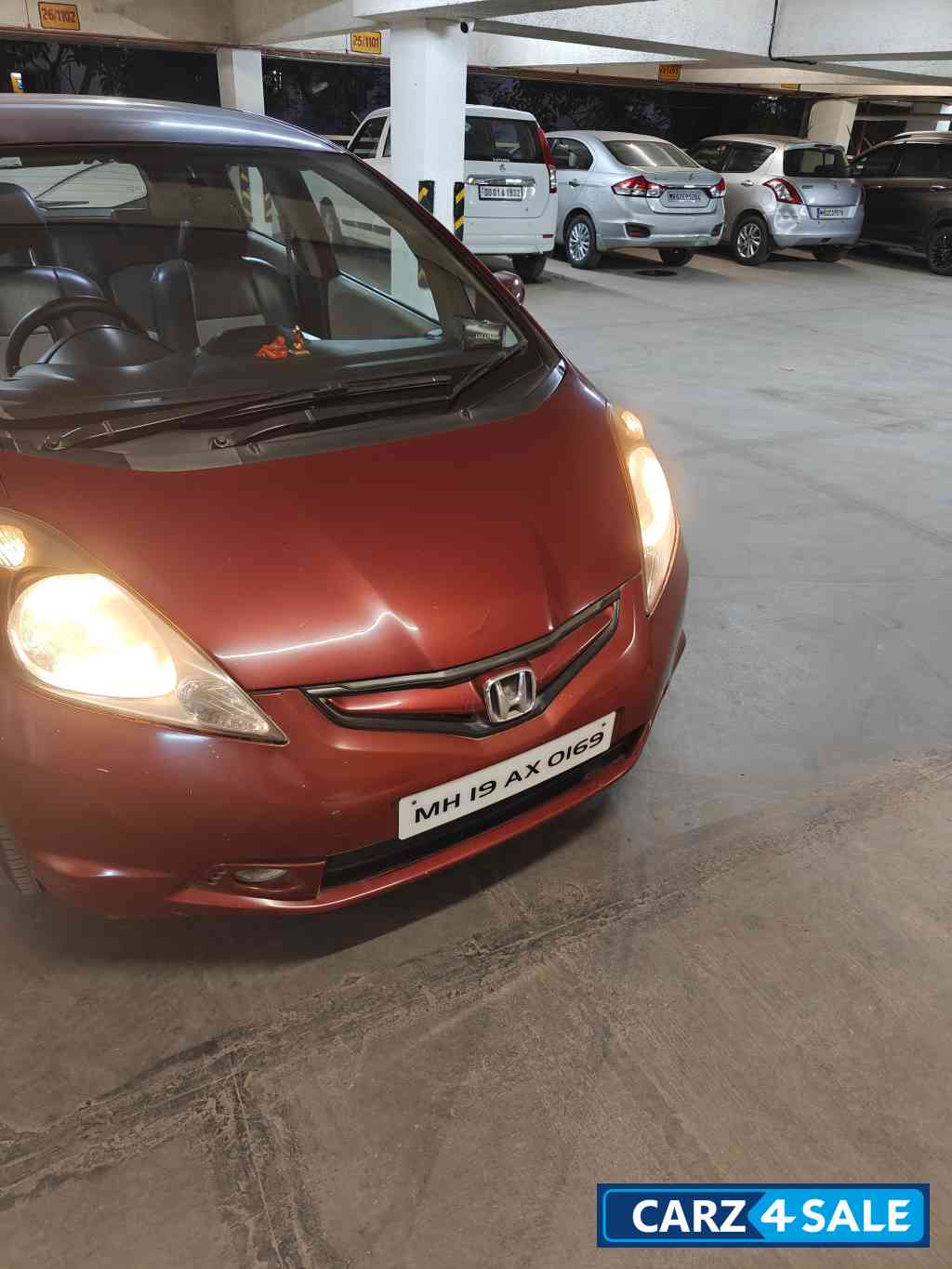 Maroon Honda Jazz Active