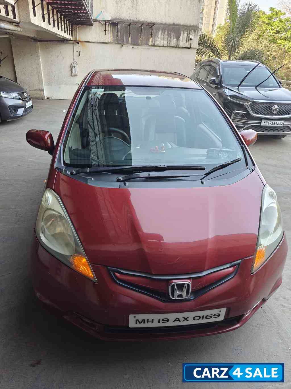 Maroon Honda Jazz Active
