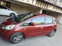 Maroon Honda Jazz Active