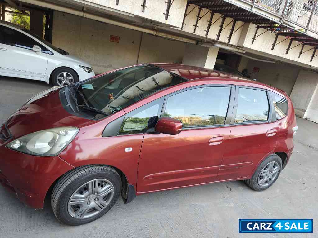 Maroon Honda Jazz Active