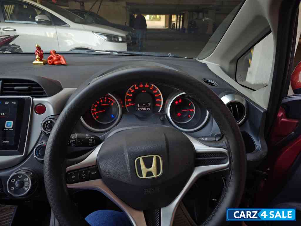 Maroon Honda Jazz Active