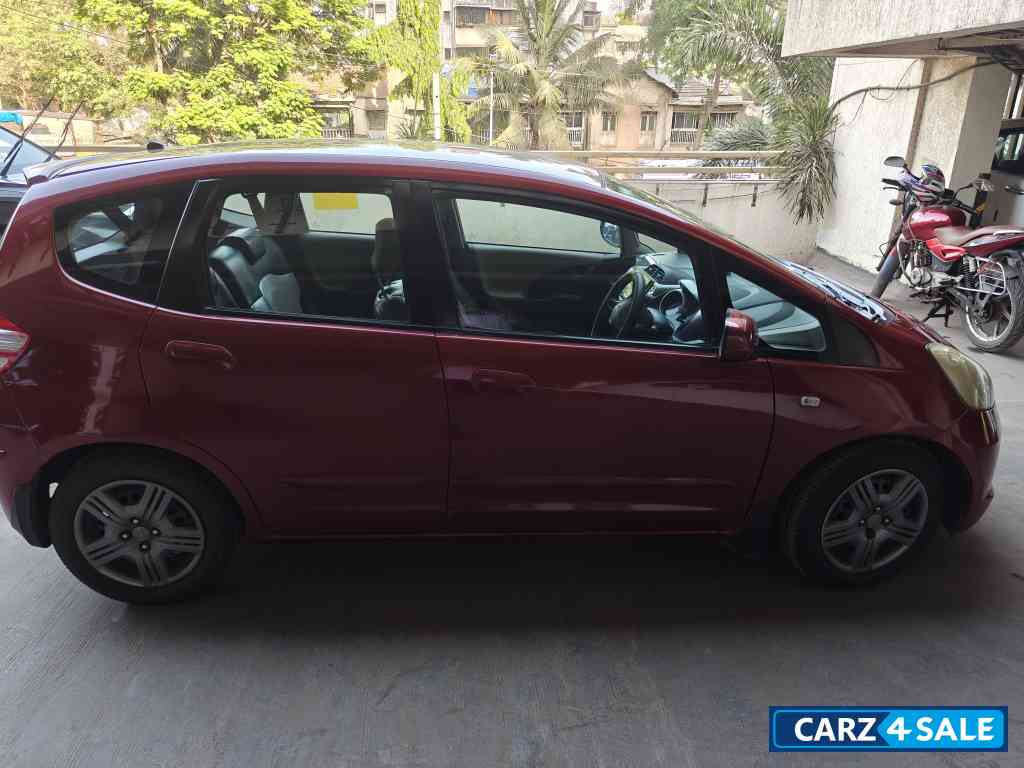 Maroon Honda Jazz Active