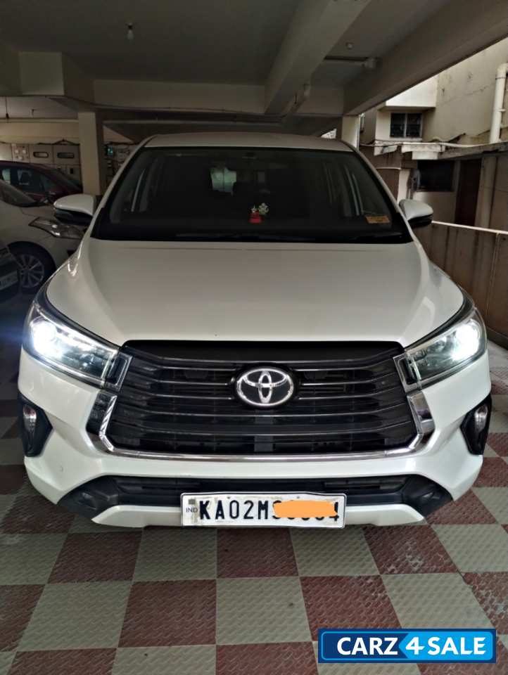 White Toyota Innova Crysta