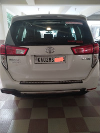 White Toyota Innova Crysta