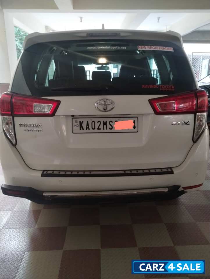 White Toyota Innova Crysta