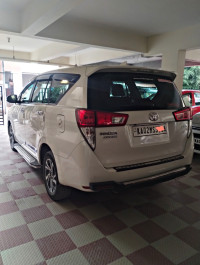 White Toyota Innova Crysta