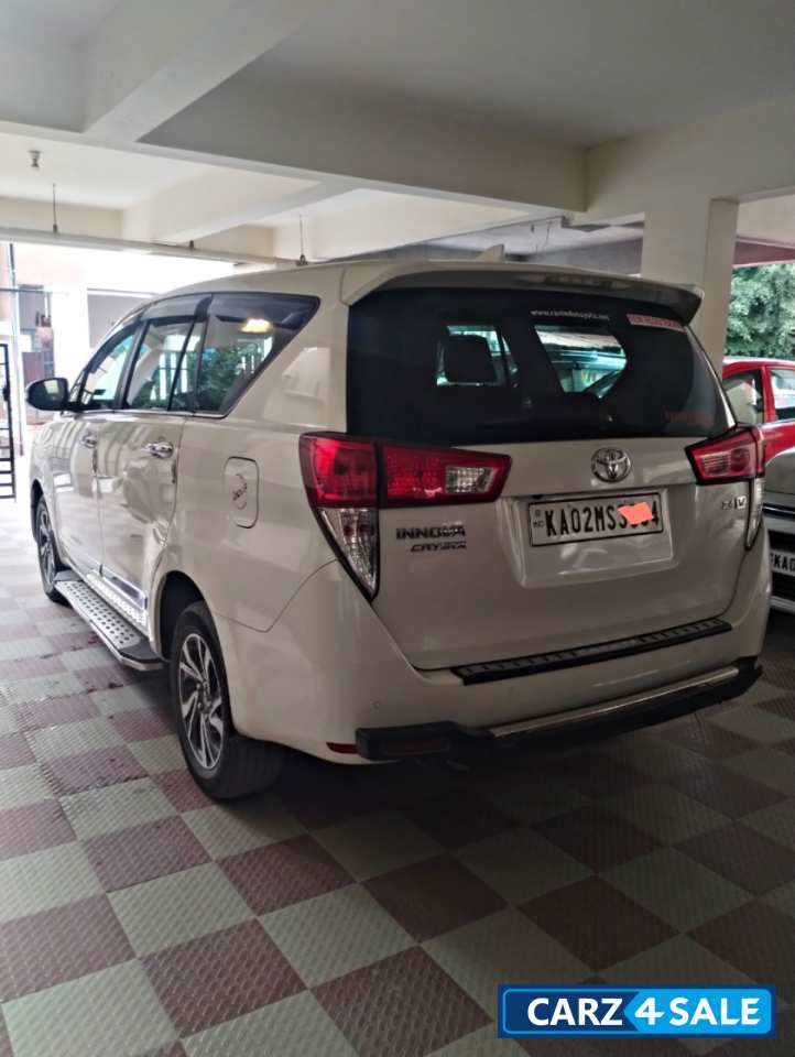 White Toyota Innova Crysta