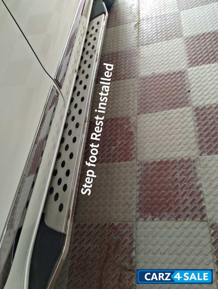 White Toyota Innova Crysta