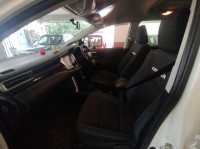 White Toyota Innova Crysta