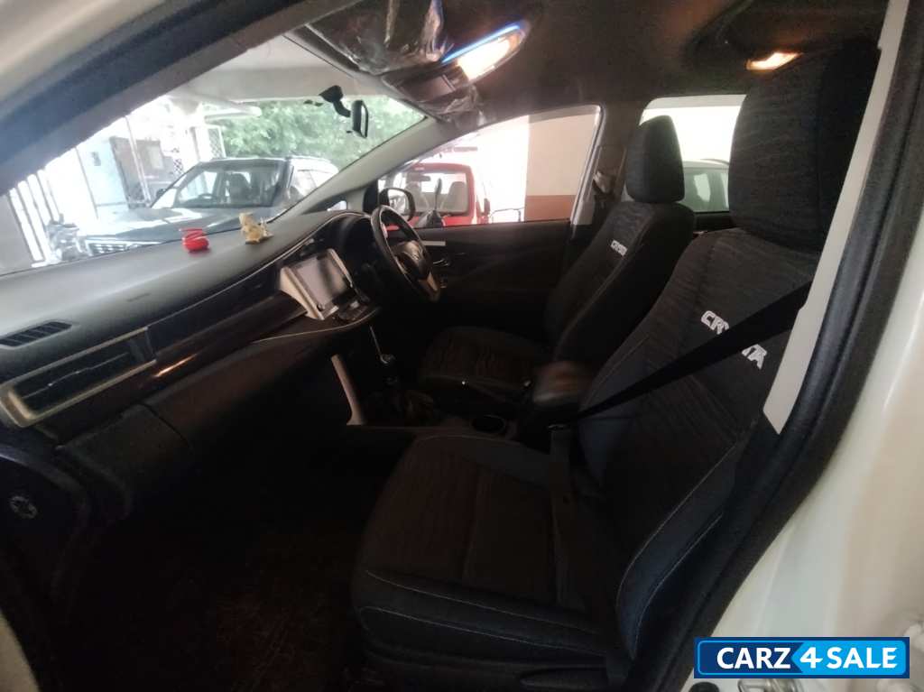 White Toyota Innova Crysta