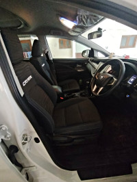 White Toyota Innova Crysta
