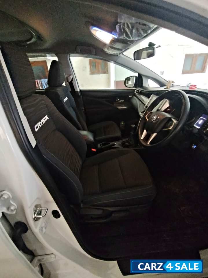 White Toyota Innova Crysta