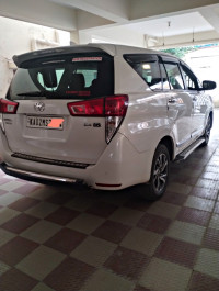 White Toyota Innova Crysta