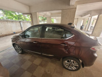 Magnetic Red Tata Tigor XZ+ petrol