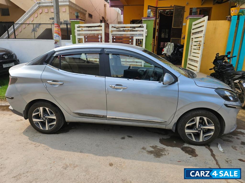 Typhoon Silver Hyundai Aura SX MT Petrol