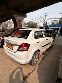 Pearl White Maruti Suzuki Dzire tour s cng