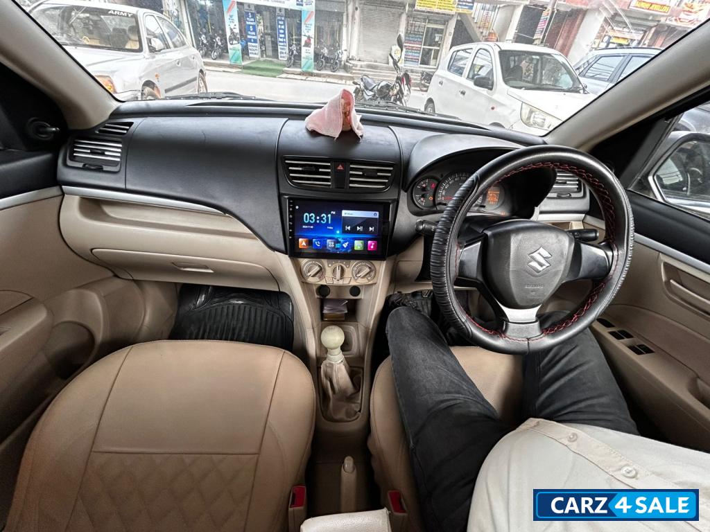Pearl White Maruti Suzuki Dzire tour s cng