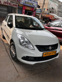 Pearl White Maruti Suzuki Dzire tour s cng
