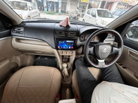 Pearl White Maruti Suzuki Dzire tour s cng