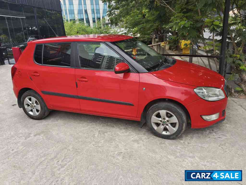 Red Skoda Fabia 1.6L