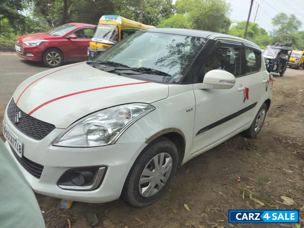 White Maruti Suzuki Swift VXI White Maruti Suzuki Swift VXI