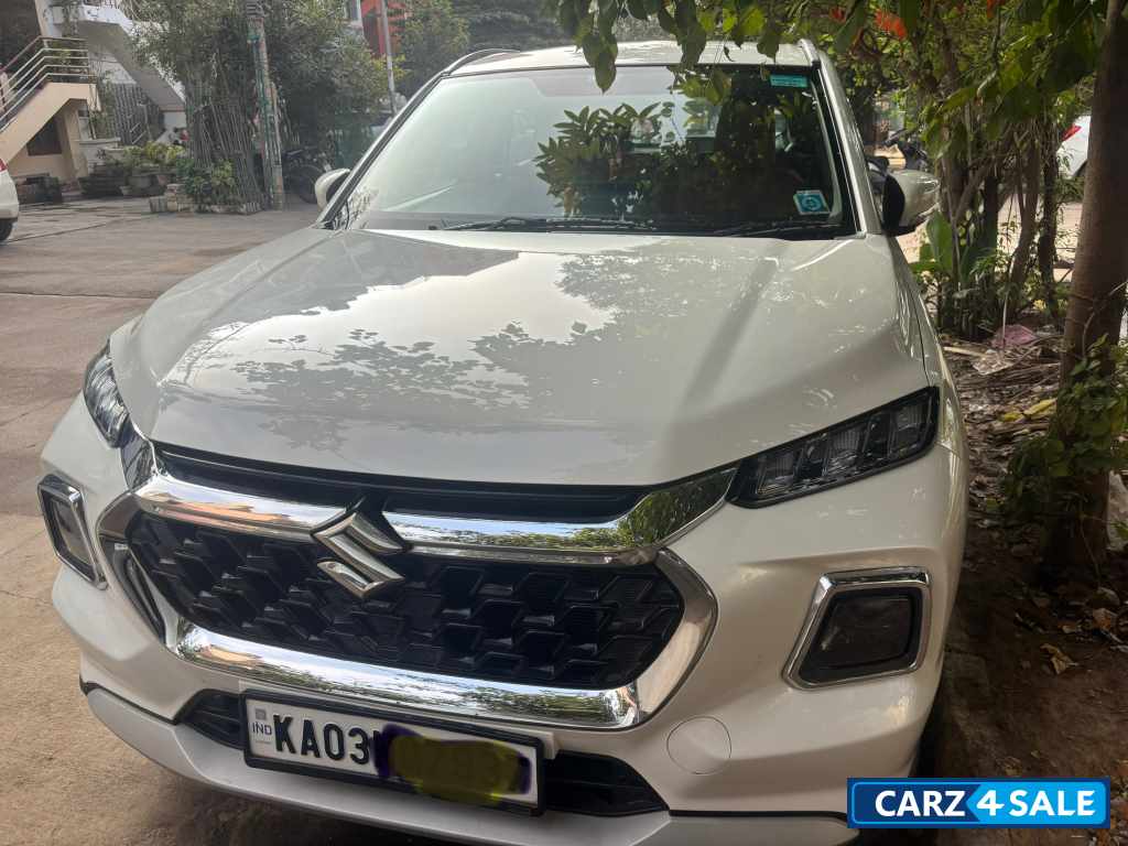 White Maruti Suzuki Grand Vitara Delta smart hybrid