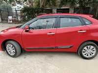 Red Maruti Suzuki Baleno Delta