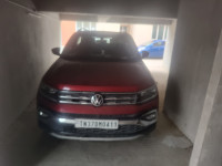 Red Volkswagen Taigun Topline MT