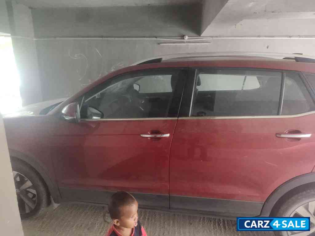 Red Volkswagen Taigun Topline MT