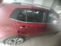 Red Volkswagen Taigun Topline MT