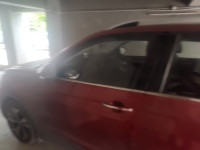 Red Volkswagen Taigun Topline MT