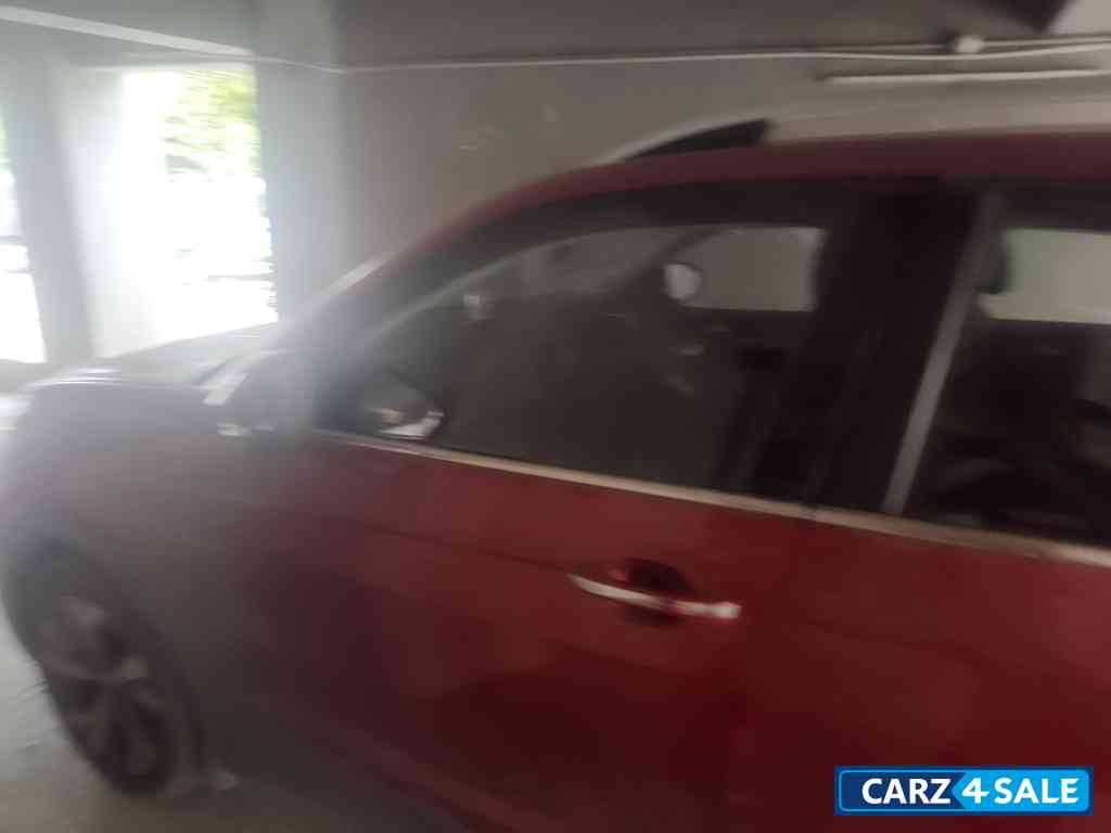 Red Volkswagen Taigun Topline MT